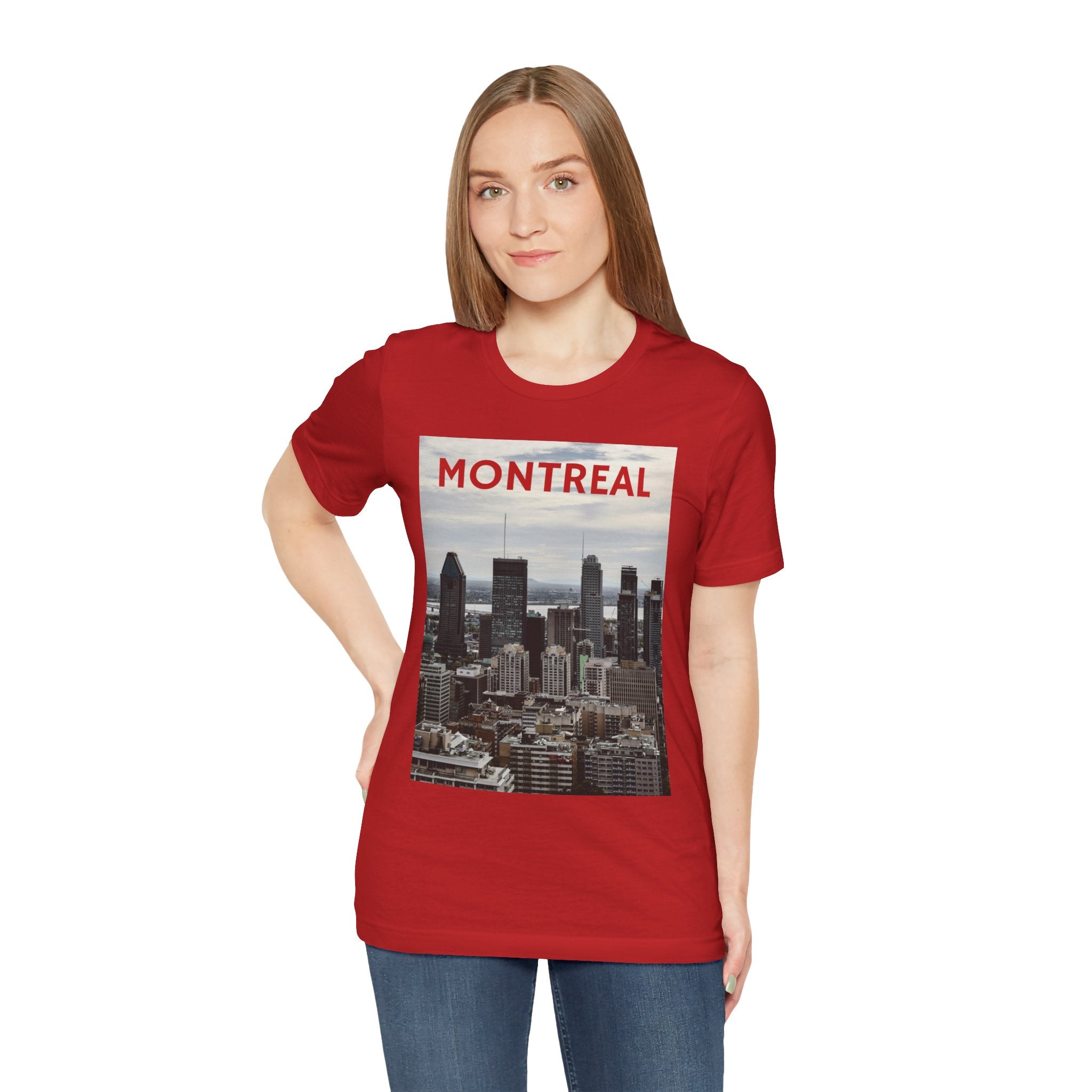 Person wearing a red t-shirt with a Montreal skyline graphic