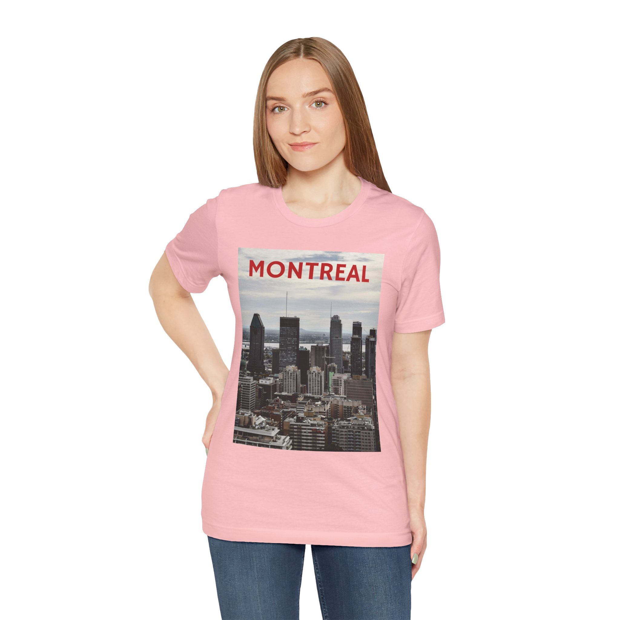 Person wearing a pink t-shirt with Montreal skyline design