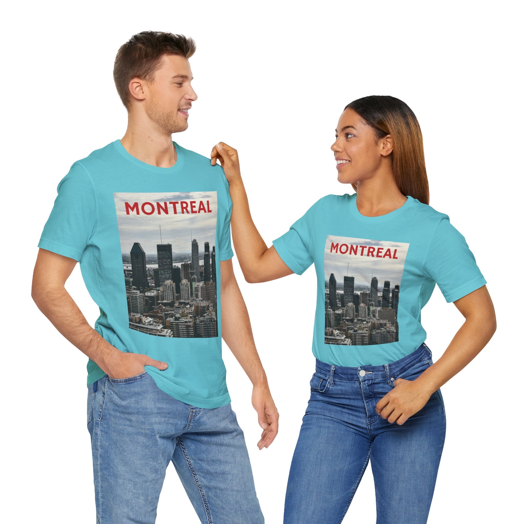 Two people wearing turquoise t-shirts with Montreal skyline design on a white background